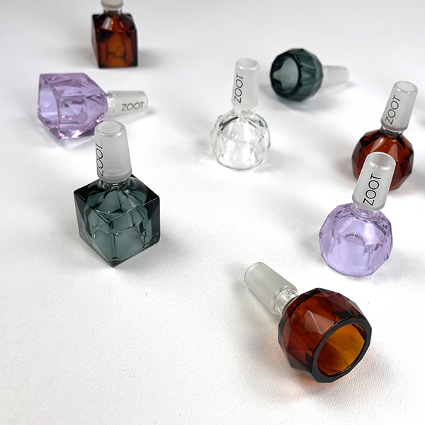 Array of faceted borosilicate bong bowls with 14mm glass joints by Zoot Stoneware.